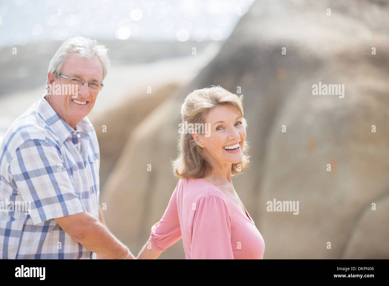 Older couple walking outdoors Stock Photo