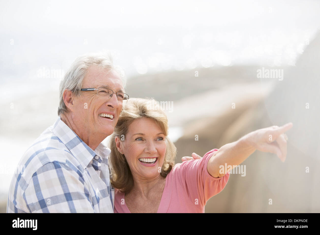 Older couple walking outdoors Stock Photo
