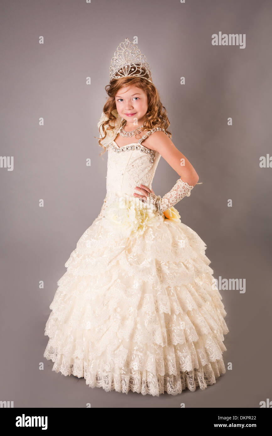 Beautiful little girl in a dress posing Stock Photo - Alamy
