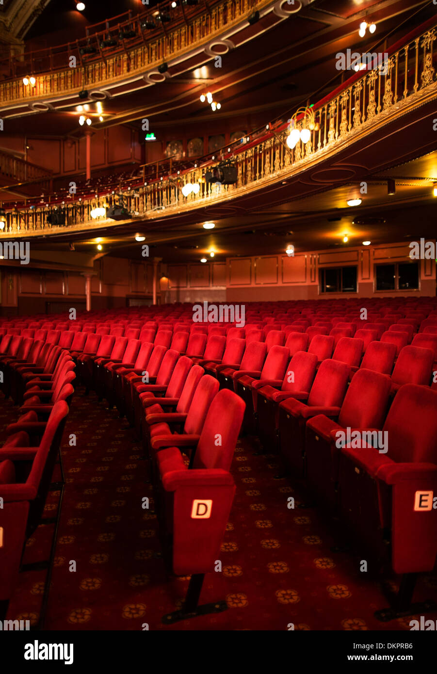 Seats in empty theater auditorium Stock Photo