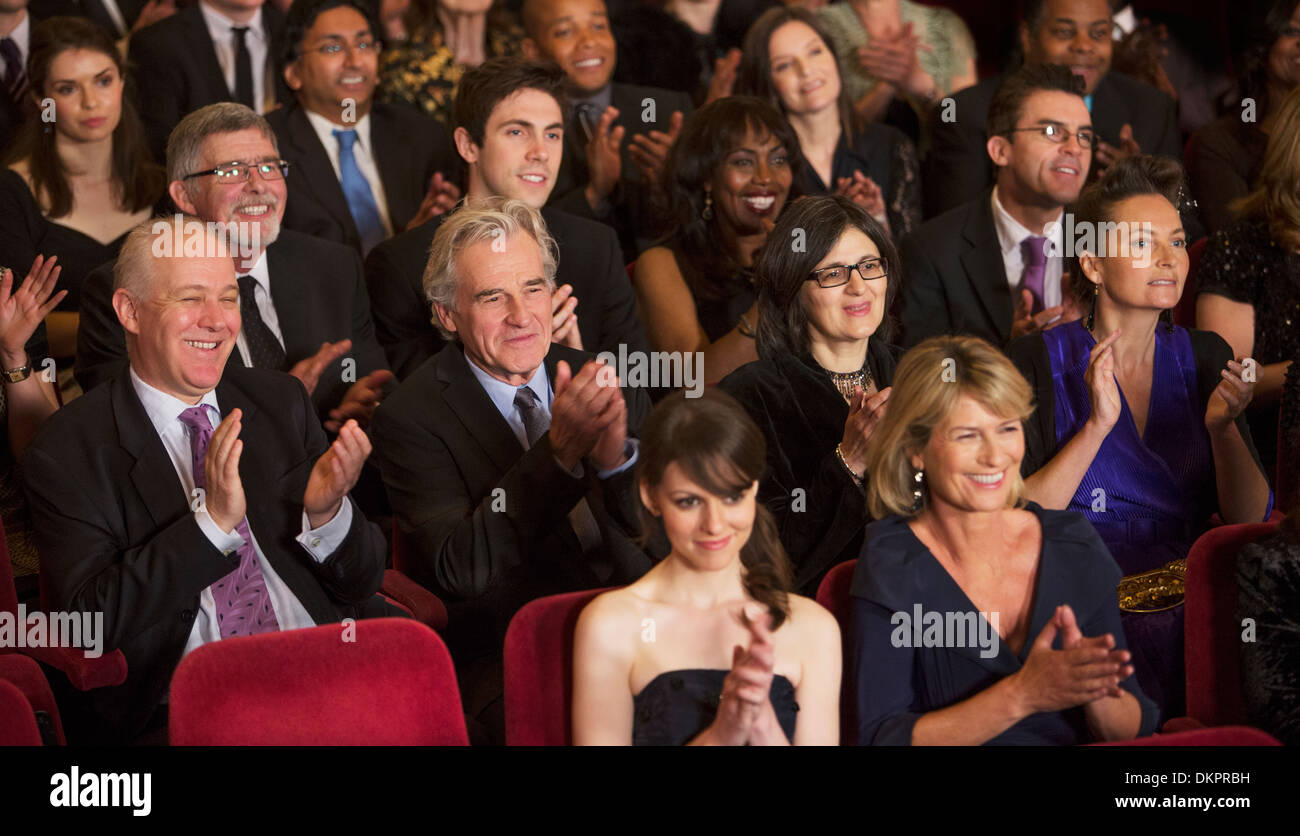 Clapping theater audience Stock Photo