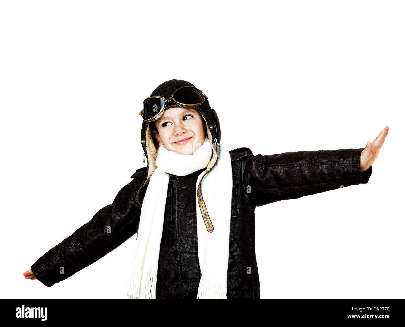Happy cute boy dressed like a World War II pilot playing with wooden ...