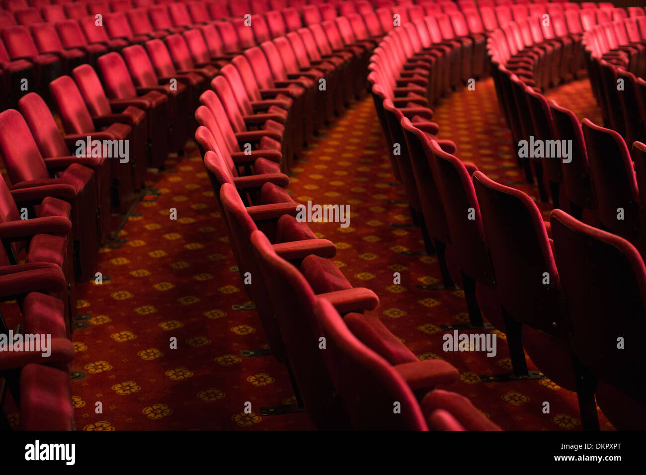 Seats in empty theater auditorium Stock Photo