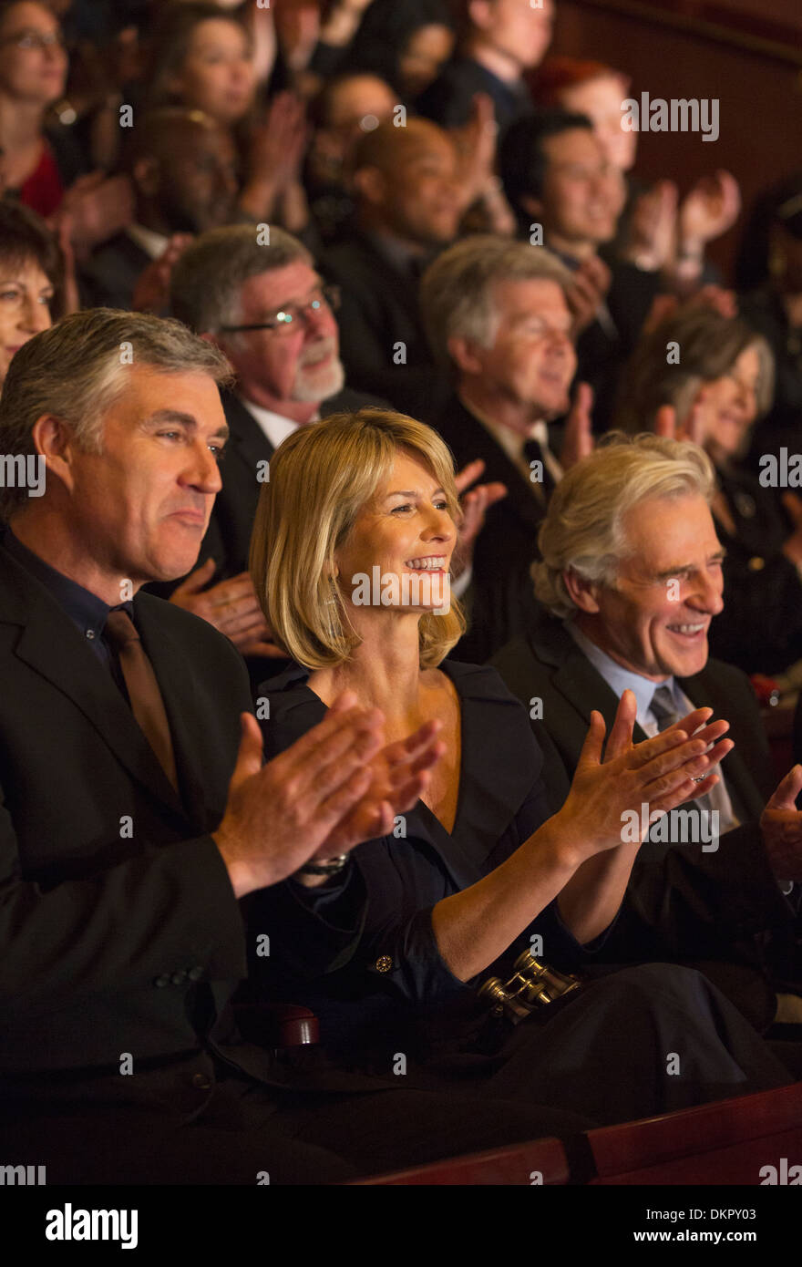 Clapping theater audience Stock Photo