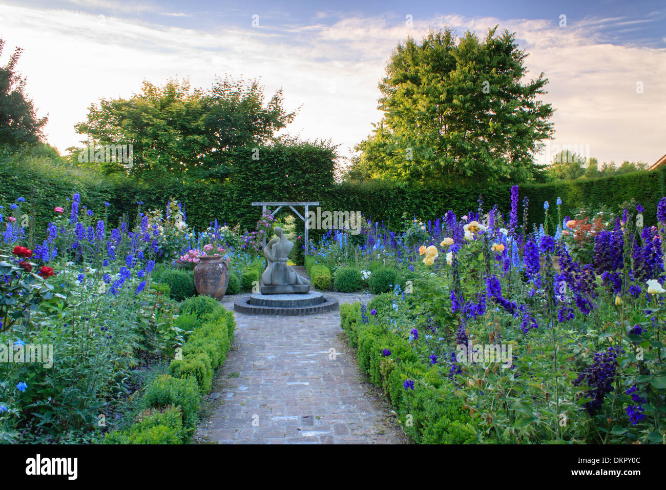 France, Calvados, Cambremer,Pays d'Auge garden,  Jardin de l'amour courtois with roses and Delphinium Stock Photo