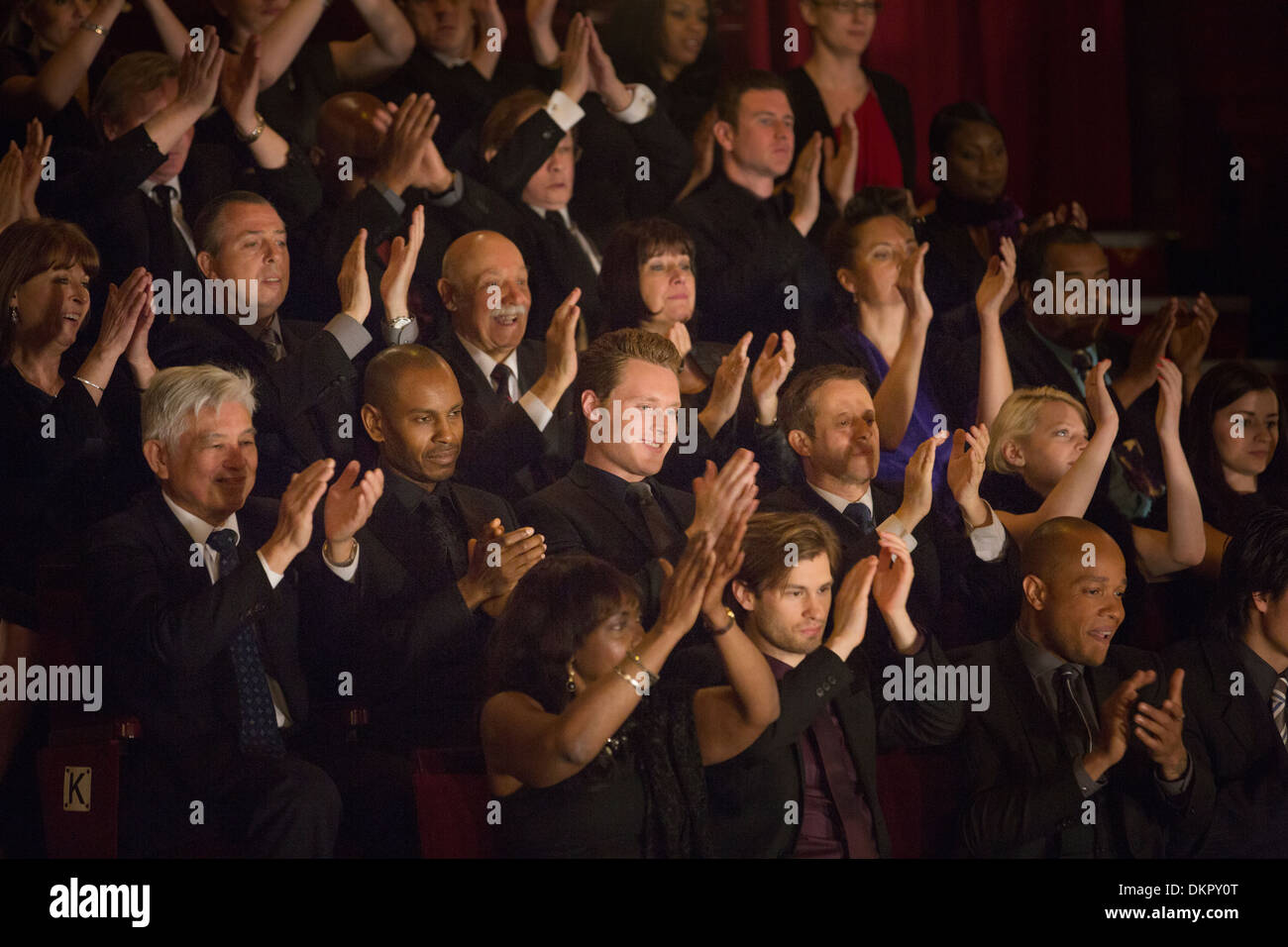 Clapping theater audience Stock Photo