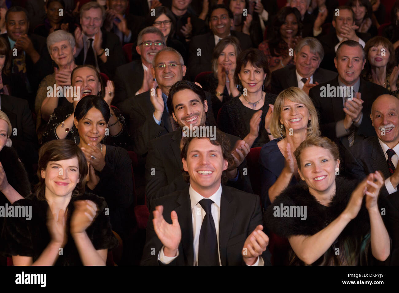 Clapping theater audience Stock Photo