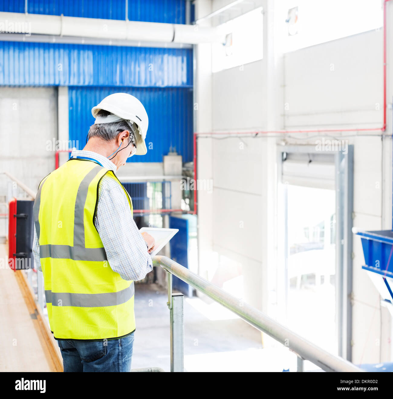Worker with digital tablet in warehouse Stock Photo