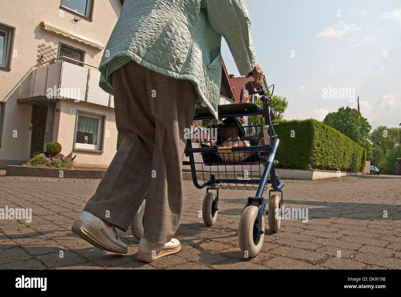 old Germany Europe woman walking car person model release pensioner person retiree wheeled walker Salzkotten boss senior Stock Photo