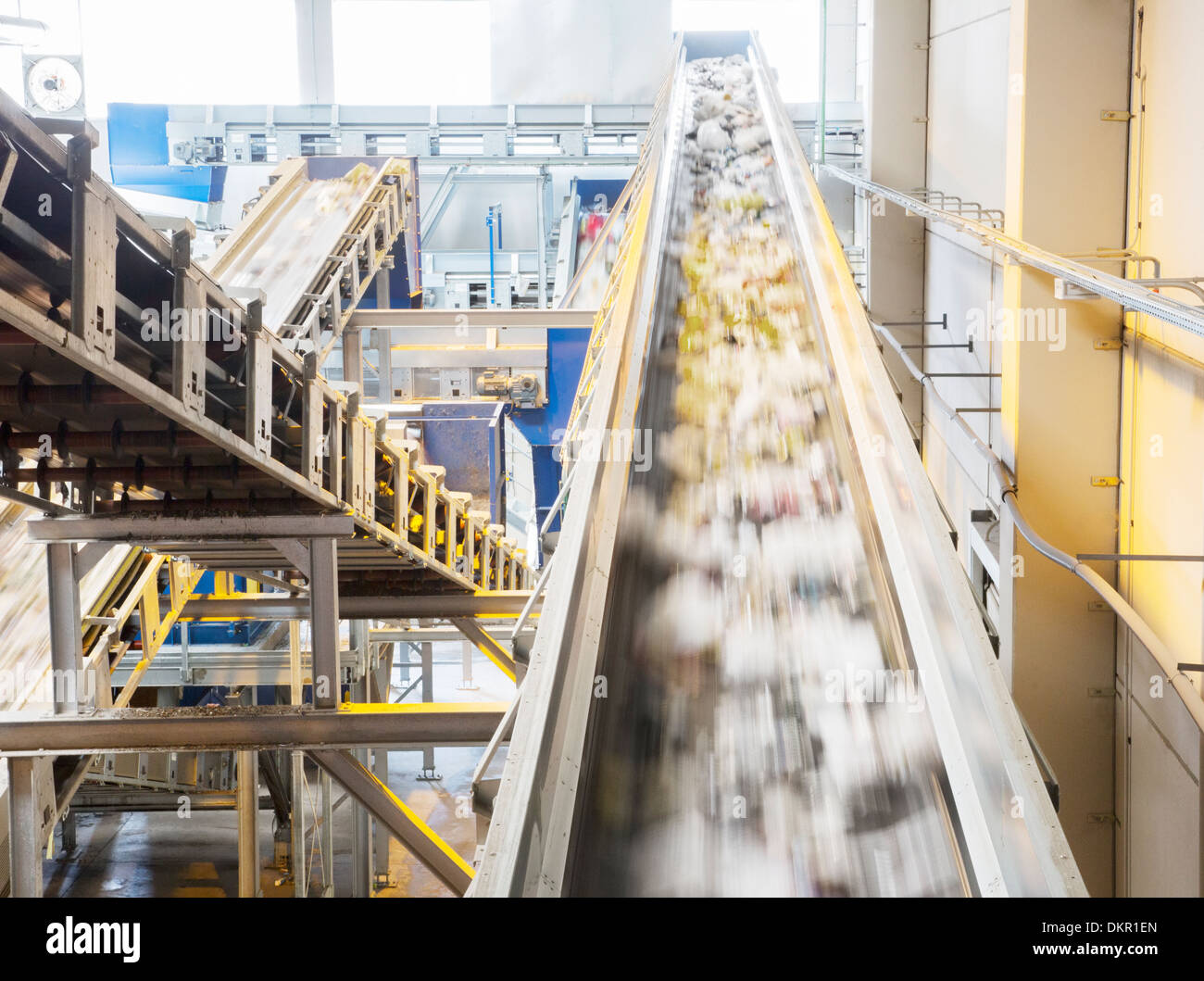 Recycling on conveyor belt in recycling center Stock Photo