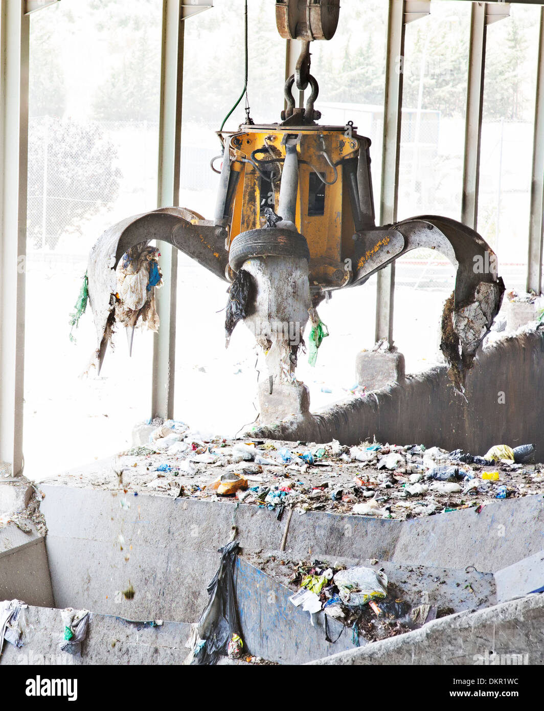 Claw releasing recycling in recycling center Stock Photo