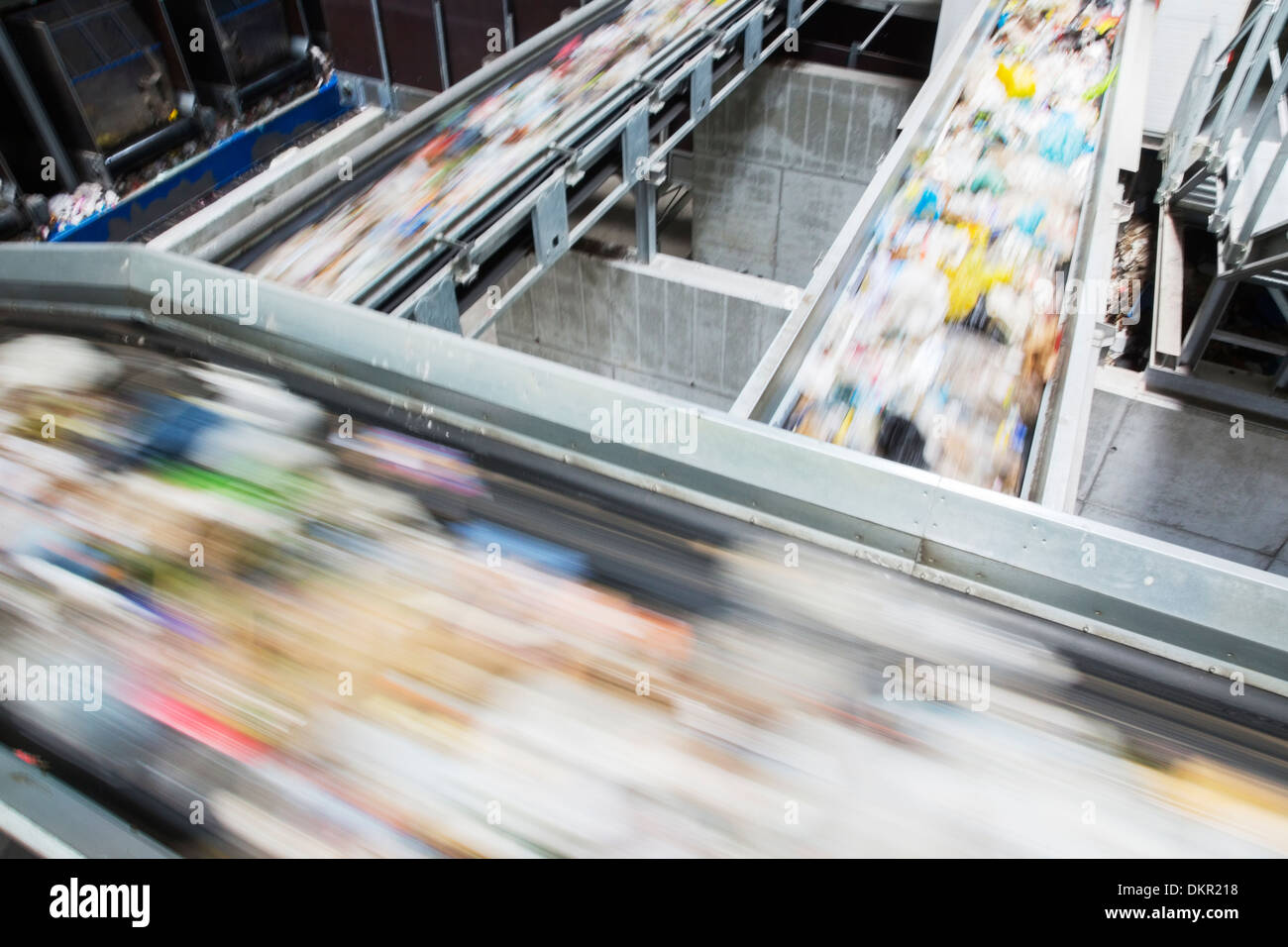 Blurred view of conveyor belts in recycling center Stock Photo