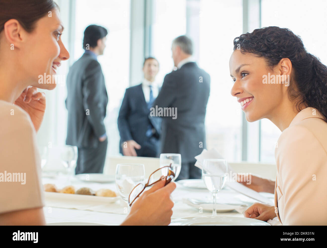 Businesswomen talking in restaurant Stock Photo