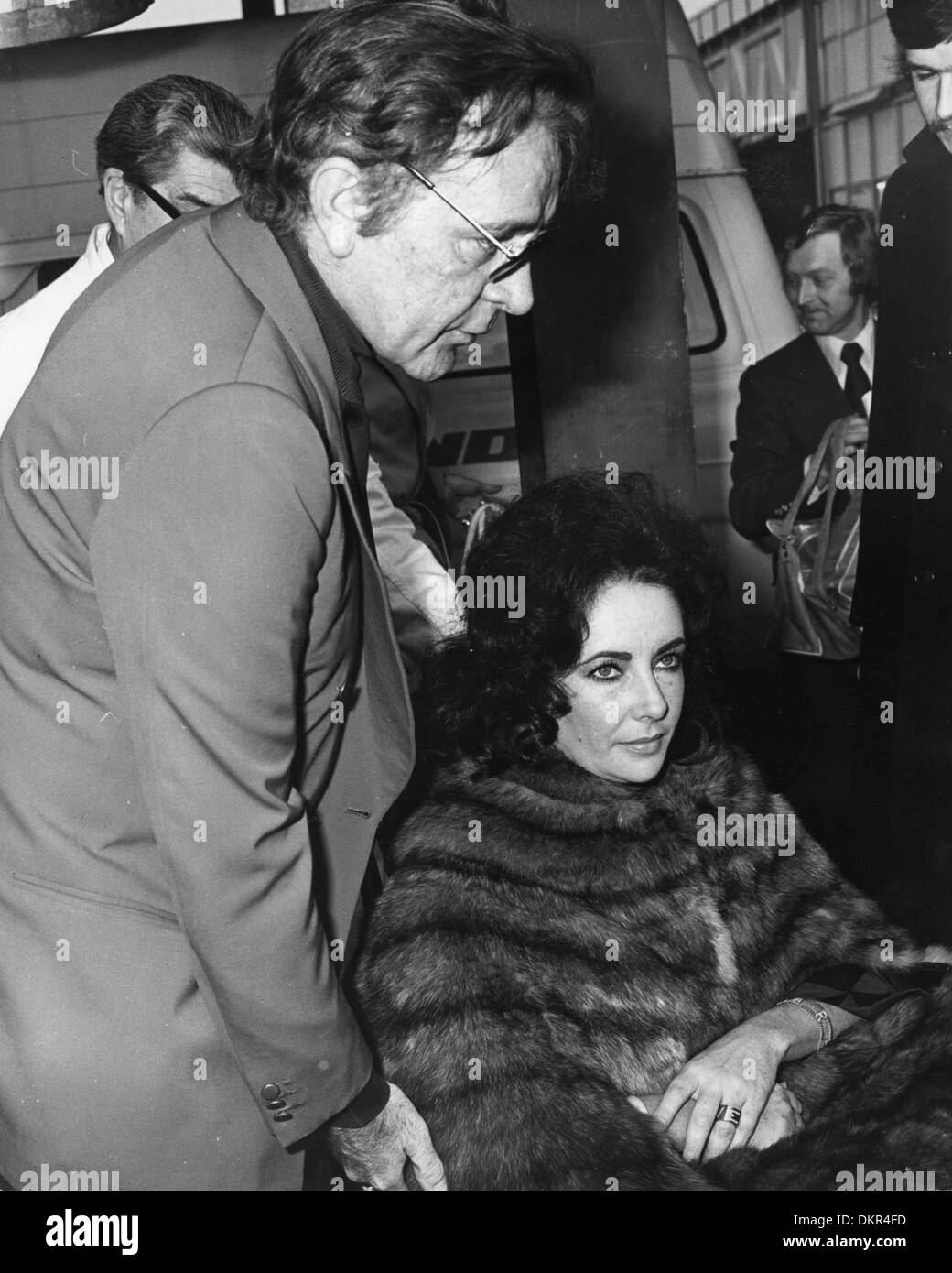 Dec. 10, 1973 - London, England, U.K. - Two time Academy Award winning actress ELIZABETH TAYLOR (1932-2011) arrives at Heathrow Airport with husband RICHARD BURTON after discharging herself from the hospital after removal of an ovarian cyst. (Credit Image: © KEYSTONE Pictures USA) Stock Photo