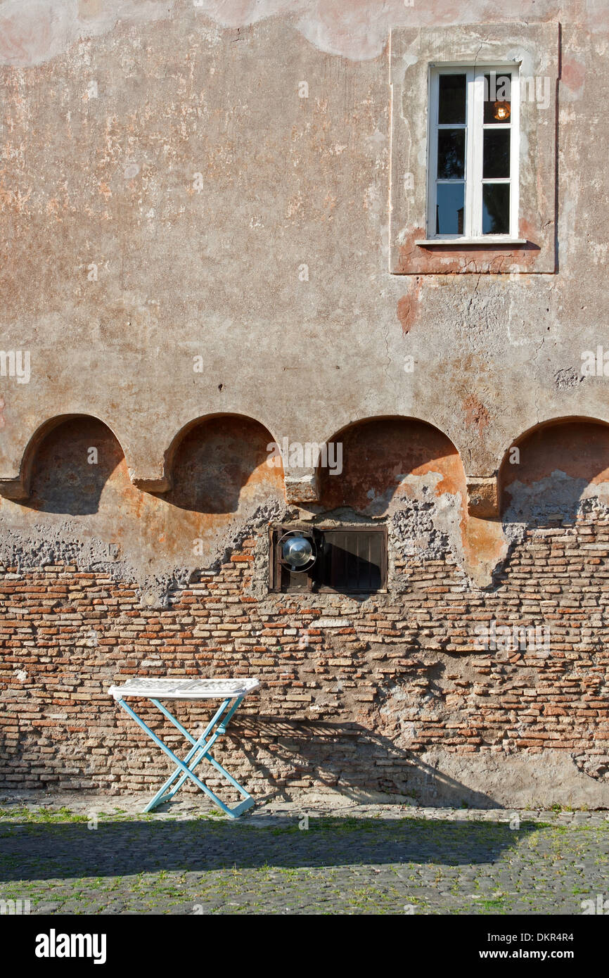 a drying rack under a window on an ancient wall in ostia, italy Stock ...