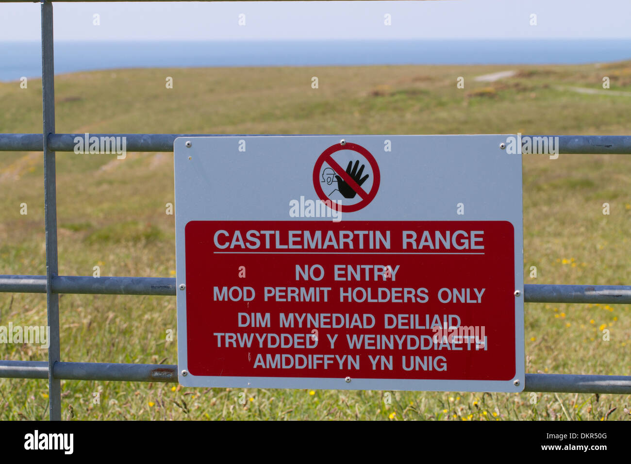 No Entry sign on gate at military firing range. Castlemartin Range. Pembrokeshire, Wales. June. Stock Photo