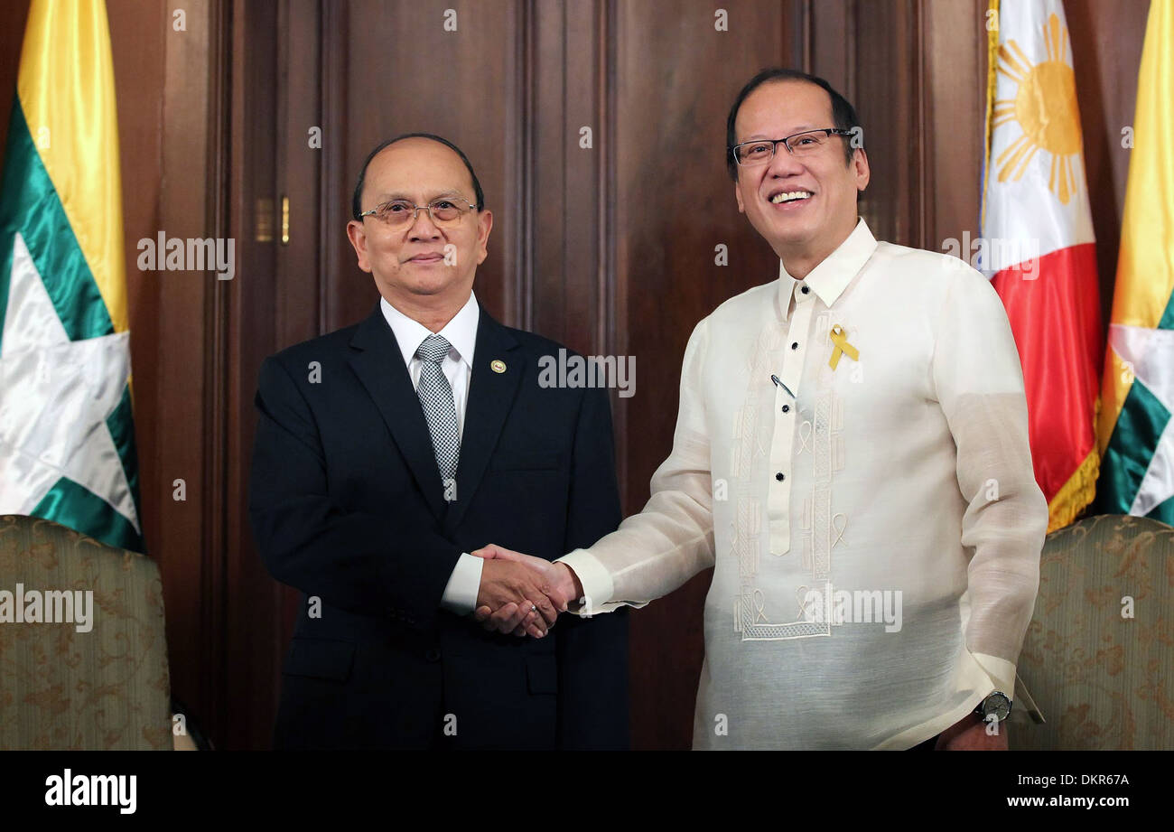 Philippine President Benigno S. Aquino III welcomes Myanmar President U Thein Sein in the Music Room of the Malaca–an Palace December 5, 2013 in Manila, the Philippines. Stock Photo