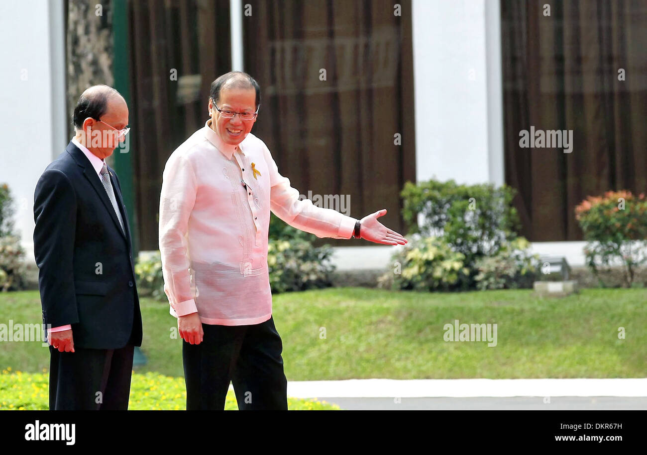 Philippine President Benigno S. Aquino III escorts Myanmar President U Thein Sein for a review of the honor guards during the arrival ceremony at the Malaca–an Palace December 5, 2013 in Manila, the Philippines. Stock Photo