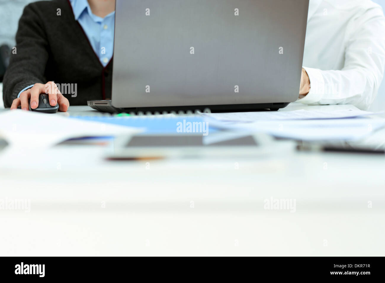 Two businessmen working on laptop in office Stock Photo