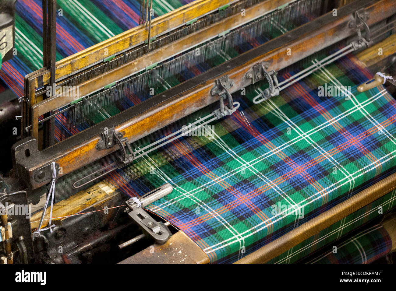 Rolls of Tartan Material being produced in fabric factory, for sale. Kilt Shop Royal Mile Edinburgh Scotland UK. Stock Photo