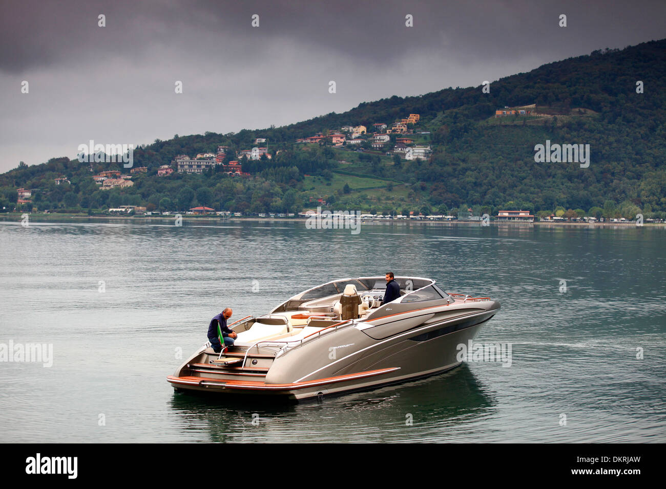 A Rivarama super yacht near the Riva factory on a misty Lake Iseo in Sarnico, Italy. Stock Photo