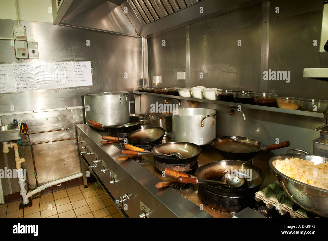 Chinese cooking with woks Stock Photo - Alamy