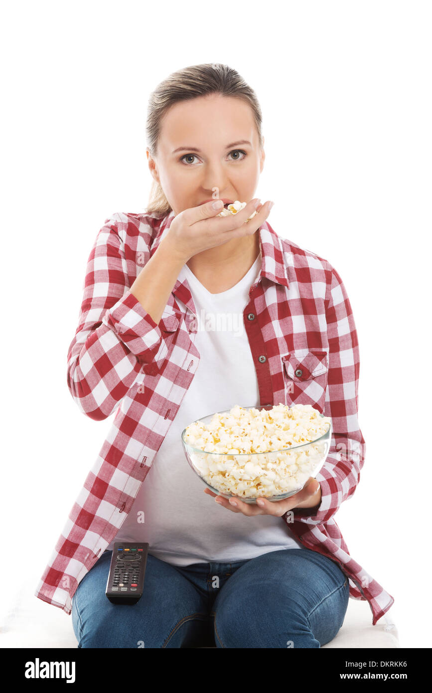 Young casual woman eating popcorn. isolated on white Stock Photo Alamy