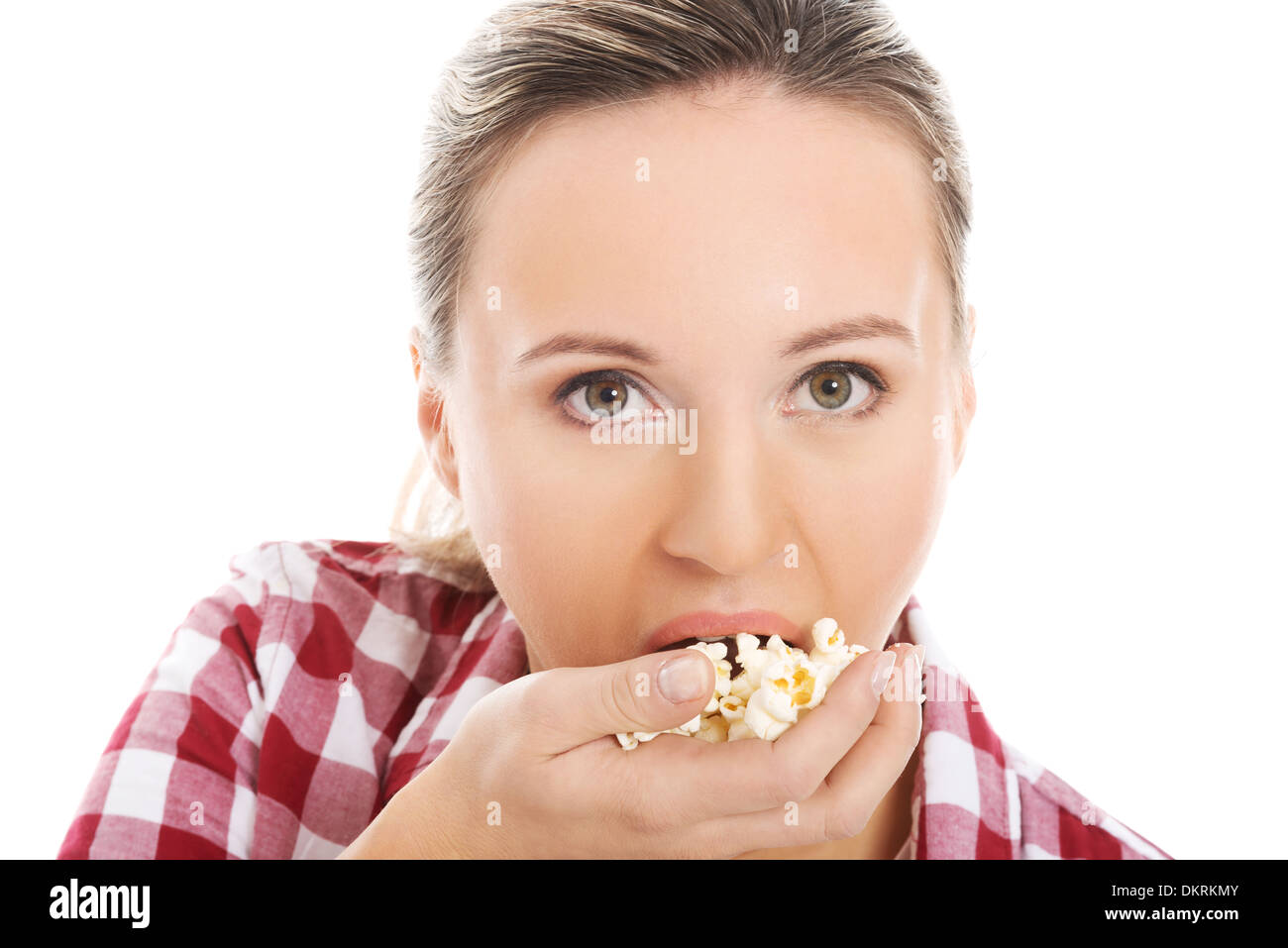 Young casual woman eating popcorn. isolated on white Stock Photo Alamy
