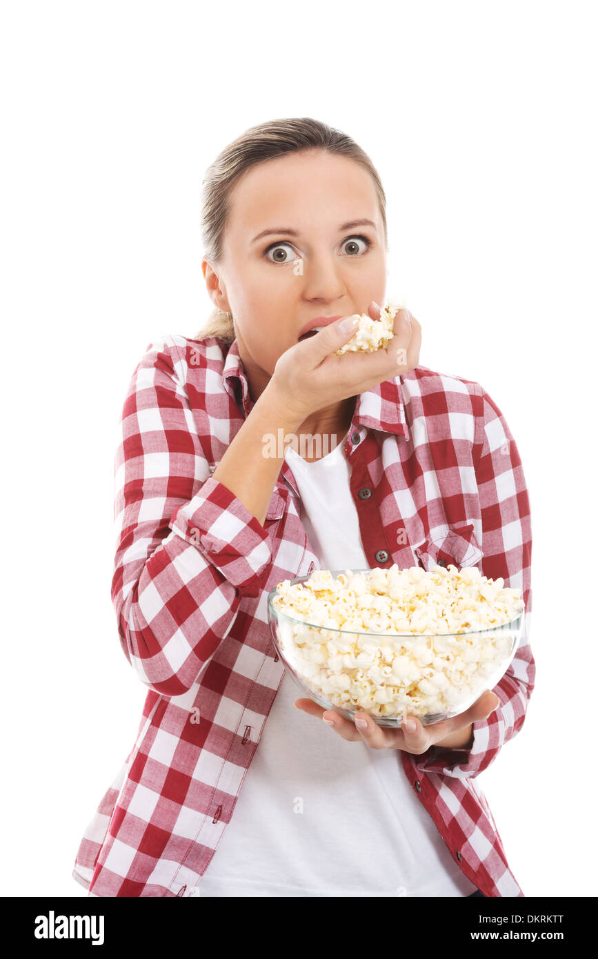 Young casual woman eating popcorn. isolated on white Stock Photo Alamy