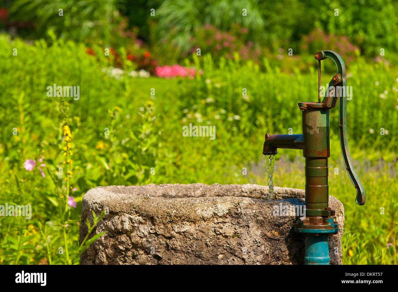 Germany Europe Bavaria Upper Bavaria Chiemgau Inzell water well lyre well stone trough fresh flow bubble channel trough flow Stock Photo