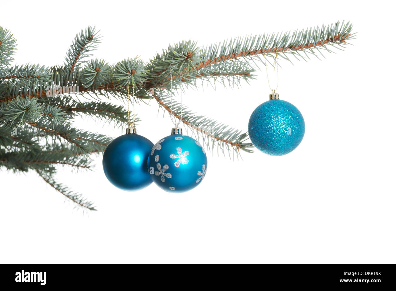 Three christmas balls hanging on a twig. Over white background Stock ...