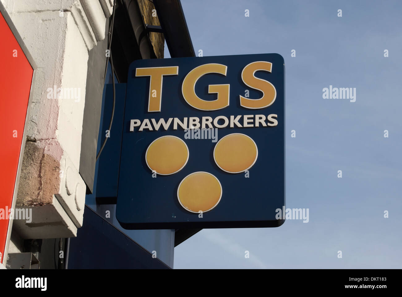 hanging sign of high street pawnbroker tgs, hounslow, middlesex, england Stock Photo