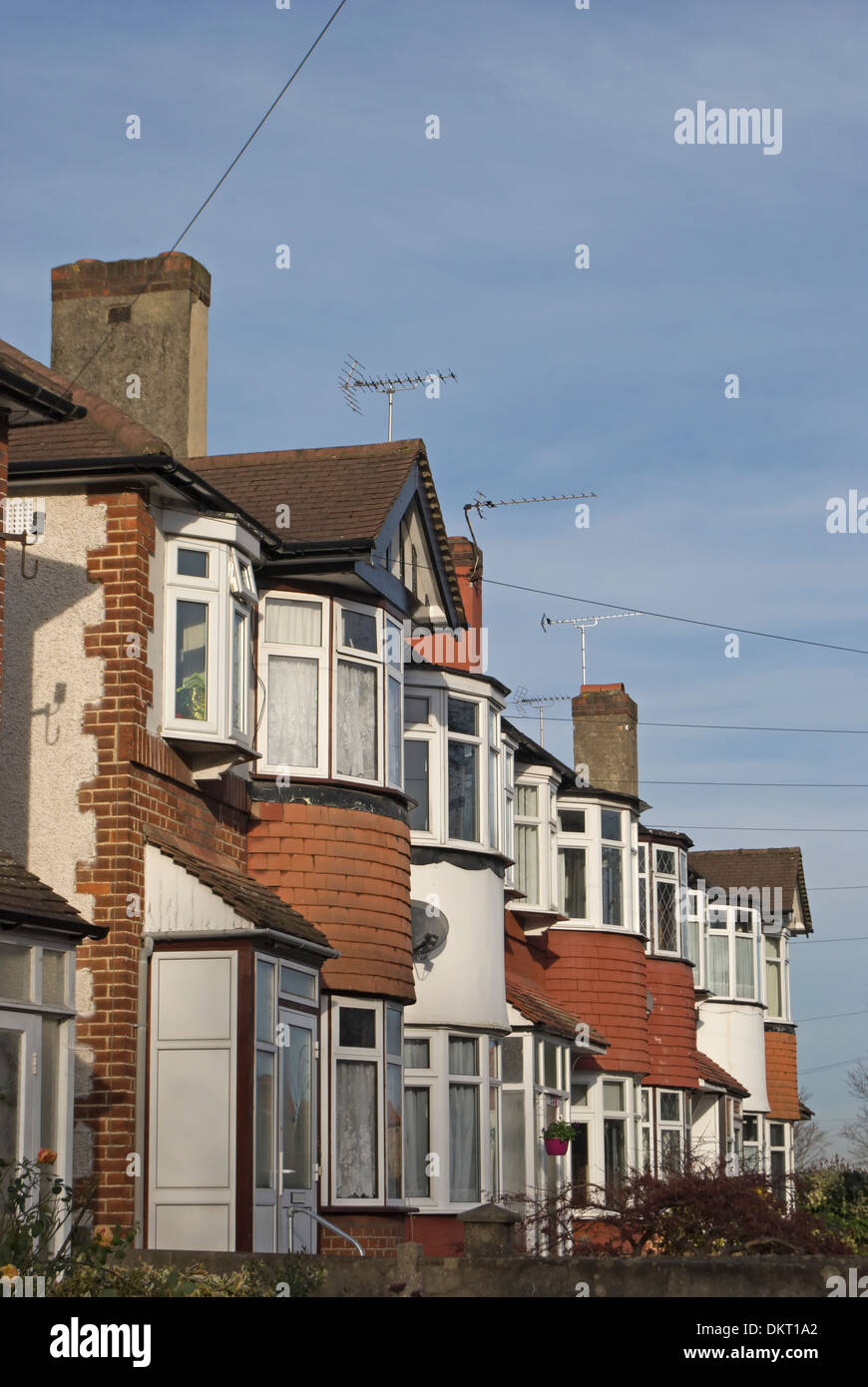 row of 1930s terraced houses with bay windows in twickenham, middlesex, england Stock Photo