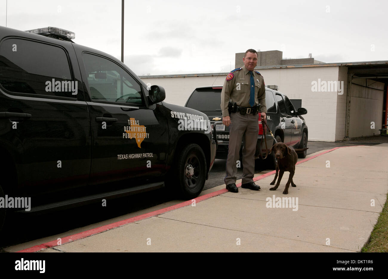 Texas Department of Public Safety officer with dog who recently completed the canine training program Stock Photo