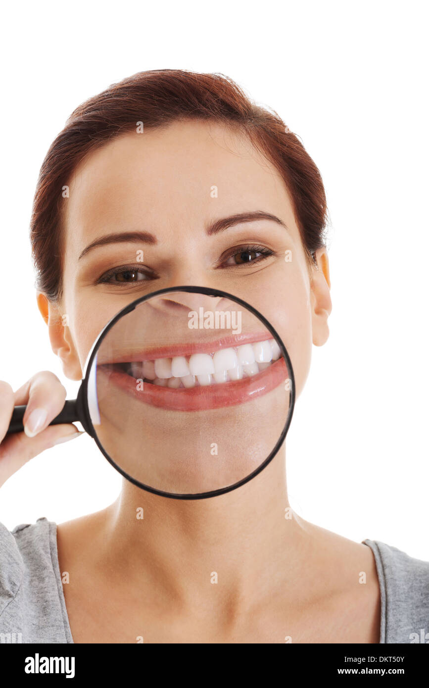 Girl holding magnifying glass to her face hires stock photography and