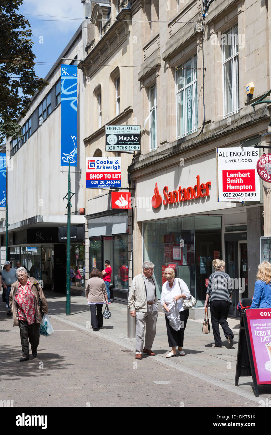 Shopping street with closed Santander shop and to let signs, Newport