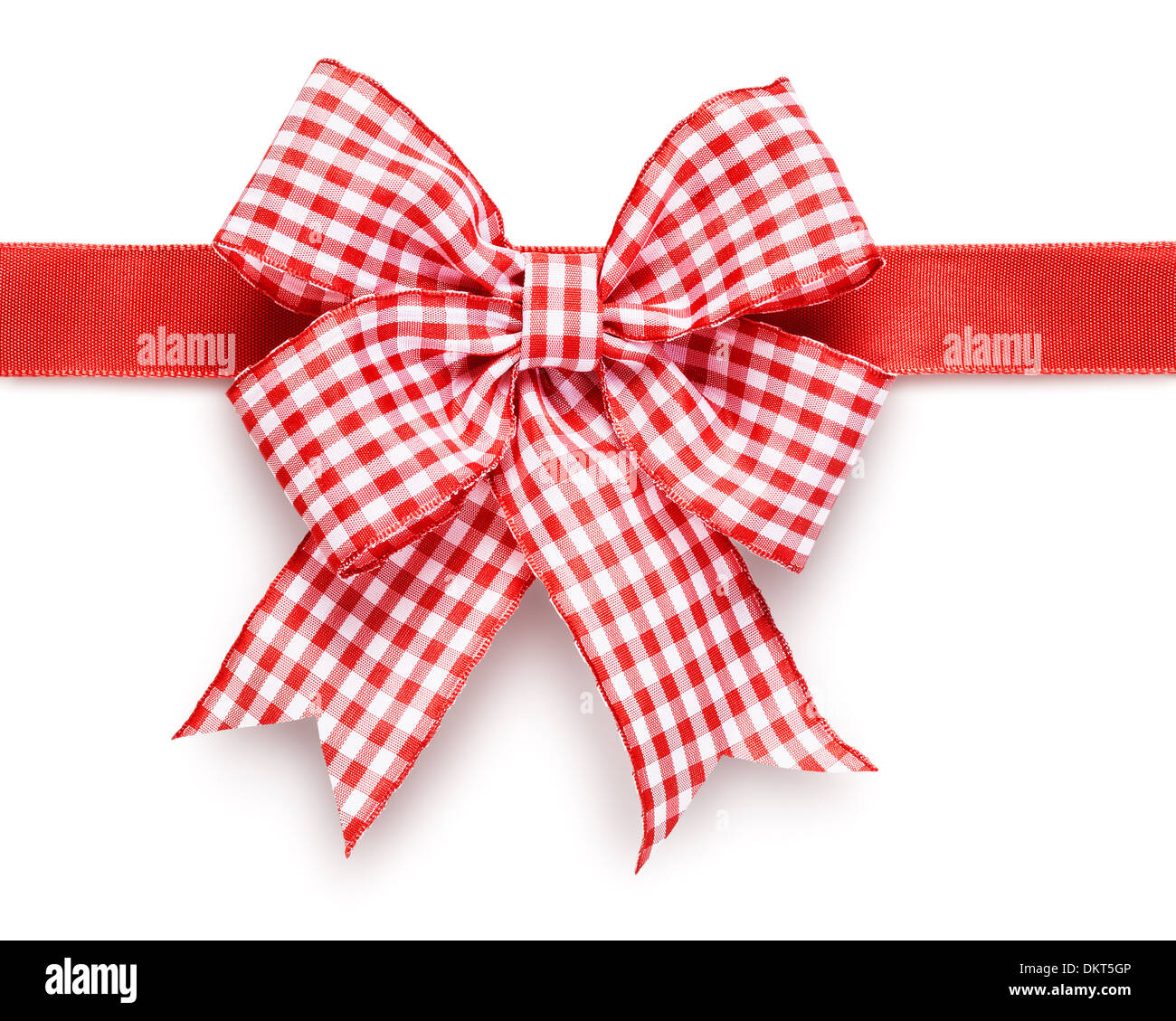 strips of red shiny ribbon and a bow over a white background with Clipping  Path, Stock image