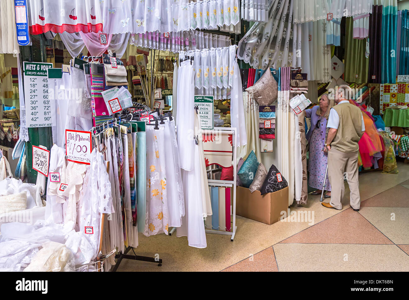 Shopping for materials in covered market, Newport, Gwent, Wales, UK Stock Photo