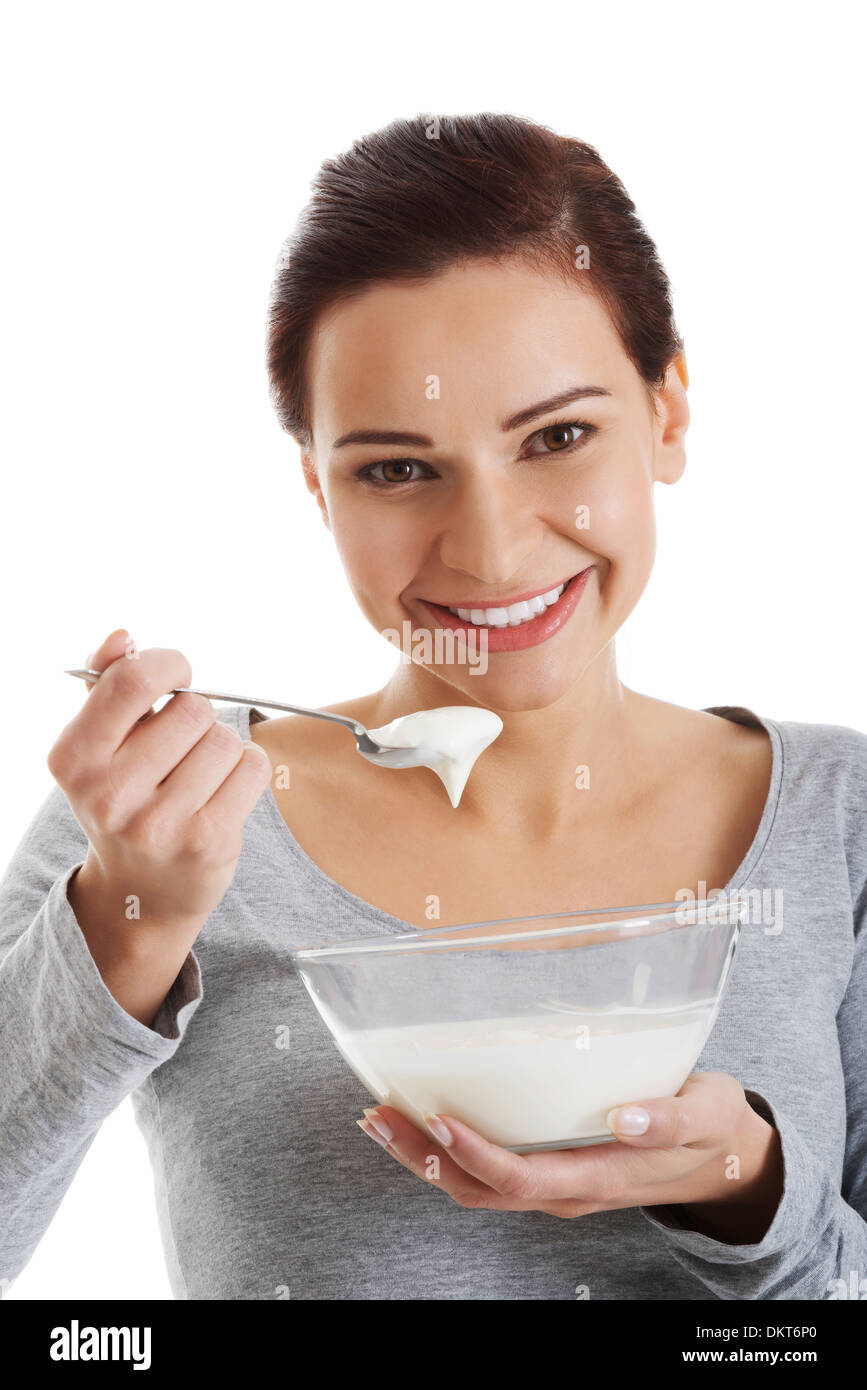 Young woman eating yogurt model hires stock photography and images Alamy