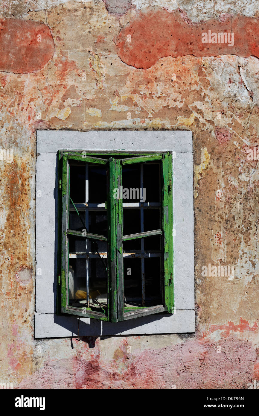 Window with rotten wood and peeling plaster, Kozina, Slovenia Stock Photo