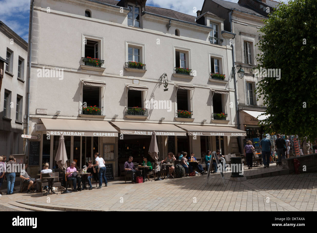 Amboise, France, in summertime. People sitting outside restaurant in