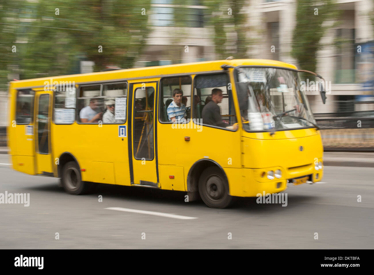 Public bus on a road in Kiev, the capital of Ukraine. Stock Photo