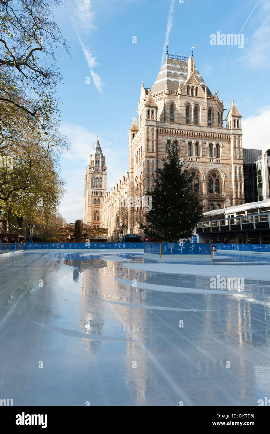 A newly resurfaced ice rink reflects the Waterhouse building of the Natural History Museum, South Kensington, London Stock Photo