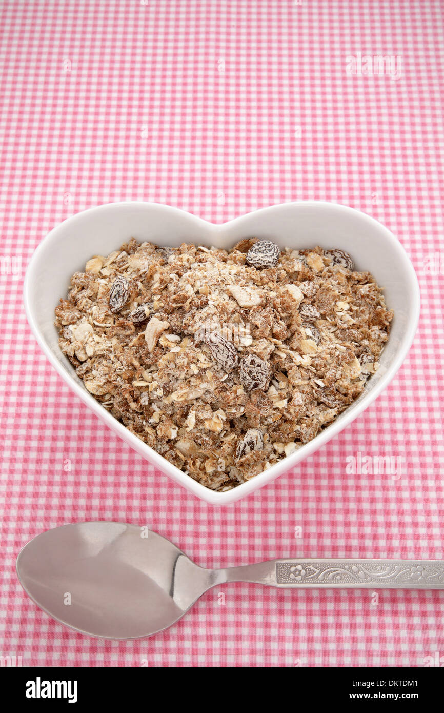 Muesli in a heart shaped bowl Stock Photo