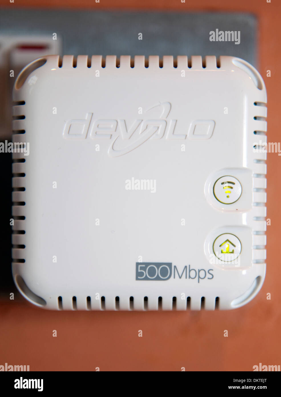 Devolo home powerline Internet wi-fi extender in socket, London Stock Photo