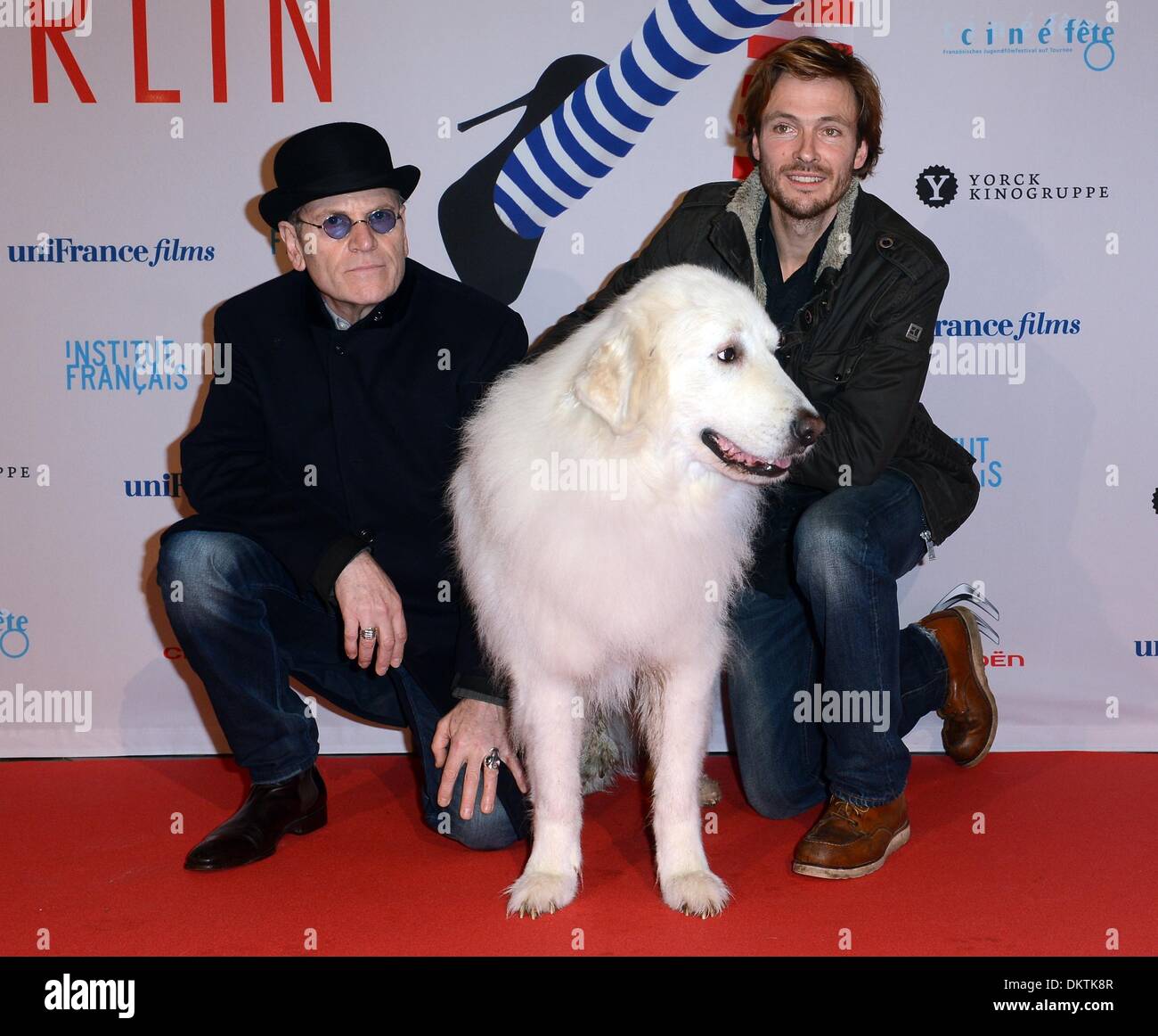 Berlin, Germany. 09th Dec, 2013. German actor Andreas Pietschmann (R) and French actor Tcheky Karyo and the Pyrenean Mountain Dog which took part in the movie arrive for the German premiere of the film 'Belle & Sebastian' during the 13th French Film Week in Berlin, Germany, 09 December 2013. French Film Week will take place from 05 till 11 December 2013. Photo: BRITTA PEDERSEN/dpa/Alamy Live News Stock Photo