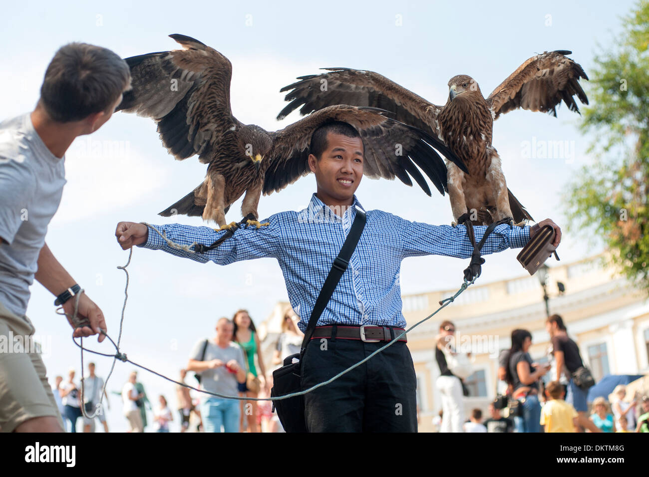 Tourist being photographed with eagles on the Potemkin Stairs in Odessa, Ukraine. Stock Photo