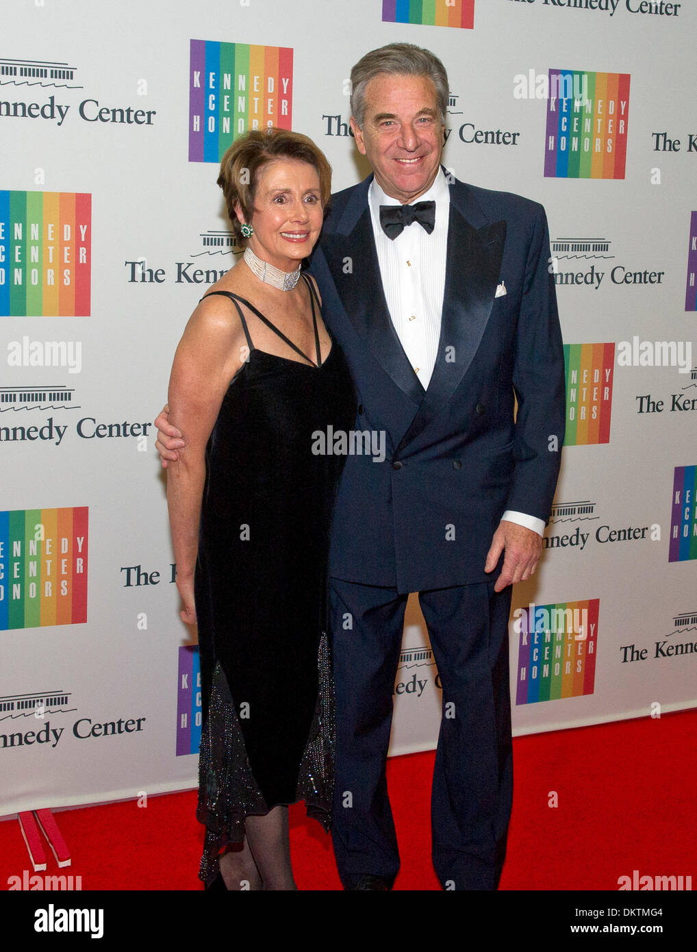 United States House Minority Leader Nancy Pelosi (Democrat of California) and her husband, Paul, arrive for the formal Artist's Dinner honoring the recipients of the 2013 Kennedy Center Honors hosted by United States Secretary of State John F. Kerry at the U.S. Department of State in Washington, DC on Saturday, December 7, 2013. Credit: Ron Sachs / CNP Stock Photo