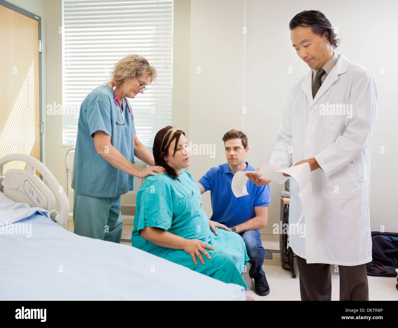 Mother Giving Birth in Hospital Stock Photo