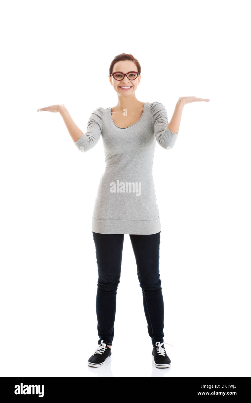 Beautiful casual woman with empty copy space on hands. Isolated on ...